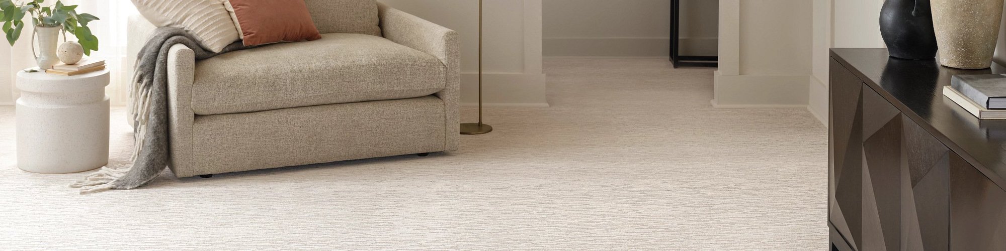 Living Room Area With Chairs And Couch on a beige carpet floor from Grand Design Floors in Maple Grove, MN