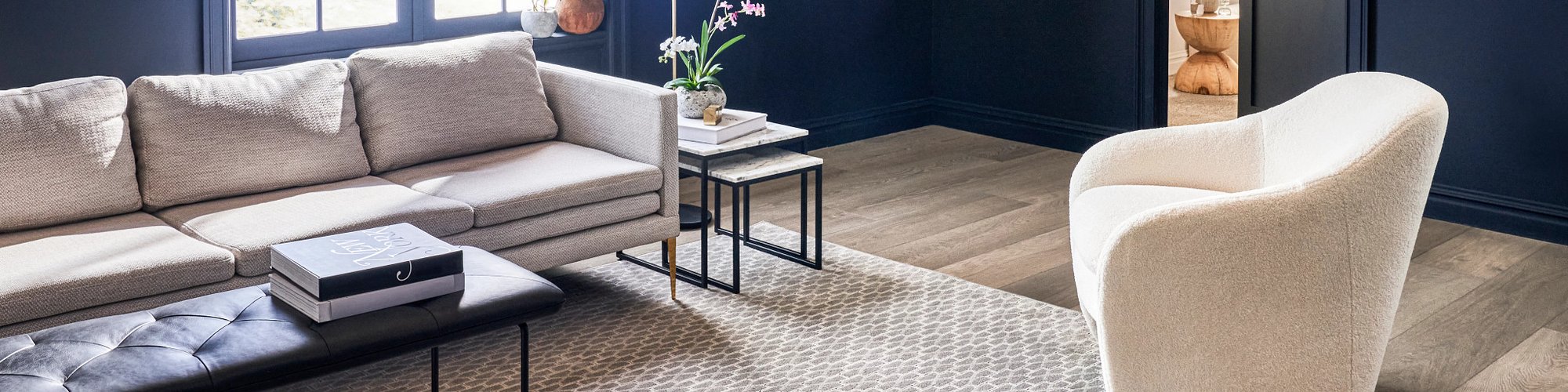 Living Room Area With Chairs And Couch on a beige area rug  from Grand Design Floors in Maple Grove, MN